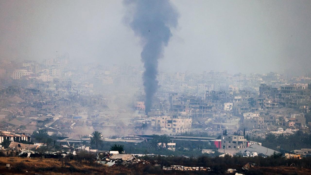 A picture taken from a position at the Israeli border with the Gaza Strip shows smoke billowing due to Israeli bombardment in the besieged Palestinian territory on May 18, 2025. Gaza's civil defence agency said Israeli air strikes on May 18 killed at least 33 people, more than half of them children, a day after Israel announced an expanded military campaign. (Photo by Menahem KAHANA / AFP)c