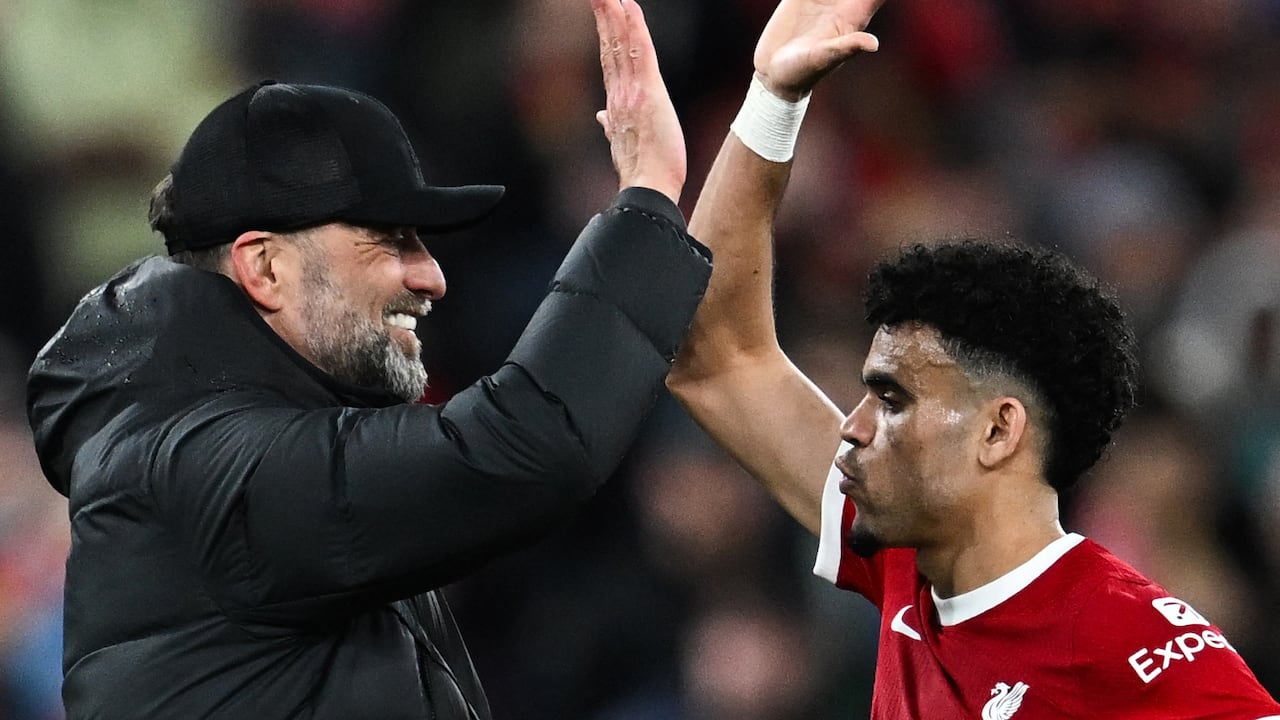 Liverpool's German manager Jurgen Klopp (L) celebrates with Liverpool's Colombian midfielder #07 Luis Diaz at the end of the English Premier League football match between Liverpool and Sheffield United at Anfield in Liverpool, north west England on April 4, 2024. Liverpool wins 3 - 1 against Sheffield United. (Photo by Paul ELLIS / AFP) / RESTRICTED TO EDITORIAL USE. No use with unauthorized audio, video, data, fixture lists, club/league logos or 'live' services. Online in-match use limited to 120 images. An additional 40 images may be used in extra time. No video emulation. Social media in-match use limited to 120 images. An additional 40 images may be used in extra time. No use in betting publications, games or single club/league/player publications. /