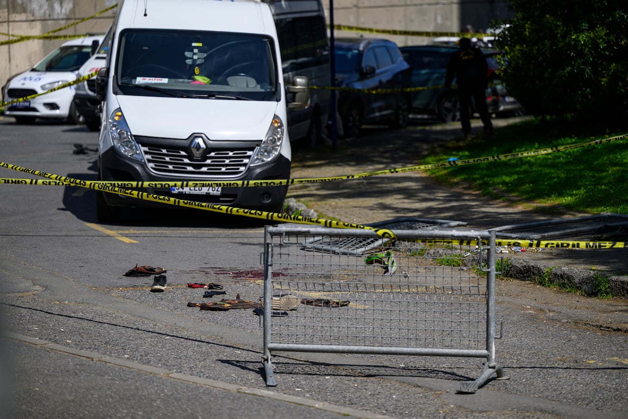 Police officials gather outside The Israeli Consulate in Istanbul on April 7, 2026, following a shootout between gunmen and police. One gunman was killed and two others were wounded in a shootout with police outside the Israeli consulate in Istanbul, the local governor said, adding two officers were lightly wounded (Photo by Yasin AKGUL / AFP)