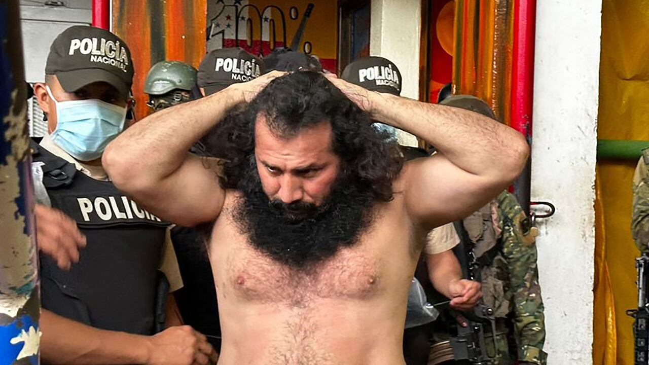 (FILES) Handout picture released by the Ecuadorean Armed Forces showing Adolfo Macias, aka Fito, leader of the Los Choneros criminal gang, while being transferred to The Rock maximum-security complex inside the Zonal Penitentiary No 8 in Guayaquil, Ecuador, during a joint operation by the Police and the Military at the facility, Ecuador, on August 12, 2023. Ecuadorean authorities are unable to find the whereabouts of alias "Fito", leader of the country's main criminal gang, (who was imprisoned), the police commander said on January 7, 2024. Hundreds of uniformed officers entered penitentiary complexes in the port of Guayaquil in the morning, the first such measure taken by President Daniel Noboa, but the reason for the operation is not yet known. The media are talking about the possibility that the leader of Los Choneros, whose real name is Adolfo Macias, may have escaped. (Photo by Ecuadorean Armed Forces / AFP) / RESTRICTED TO EDITORIAL USE - MANDATORY CREDIT "AFP PHOTO / ECUADOREAN ARMED FORCES" - NO MARKETING - NO ADVERTISING CAMPAIGNS - DISTRIBUTED AS A SERVICE TO CLIENTS