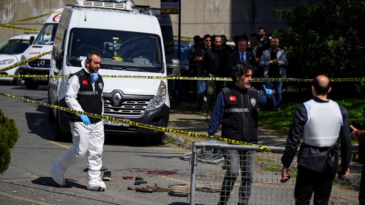 Police officials gather outside The Israeli Consulate in Istanbul on April 7, 2026, following a shootout between gunmen and police. One gunman was killed and two others were wounded in a shootout with police outside the Israeli consulate in Istanbul, the local governor said, adding two officers were lightly wounded (Photo by Yasin AKGUL / AFP)