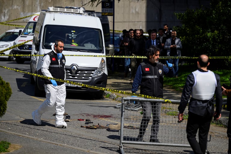 Police officials gather outside The Israeli Consulate in Istanbul on April 7, 2026, following a shootout between gunmen and police. One gunman was killed and two others were wounded in a shootout with police outside the Israeli consulate in Istanbul, the local governor said, adding two officers were lightly wounded (Photo by Yasin AKGUL / AFP)