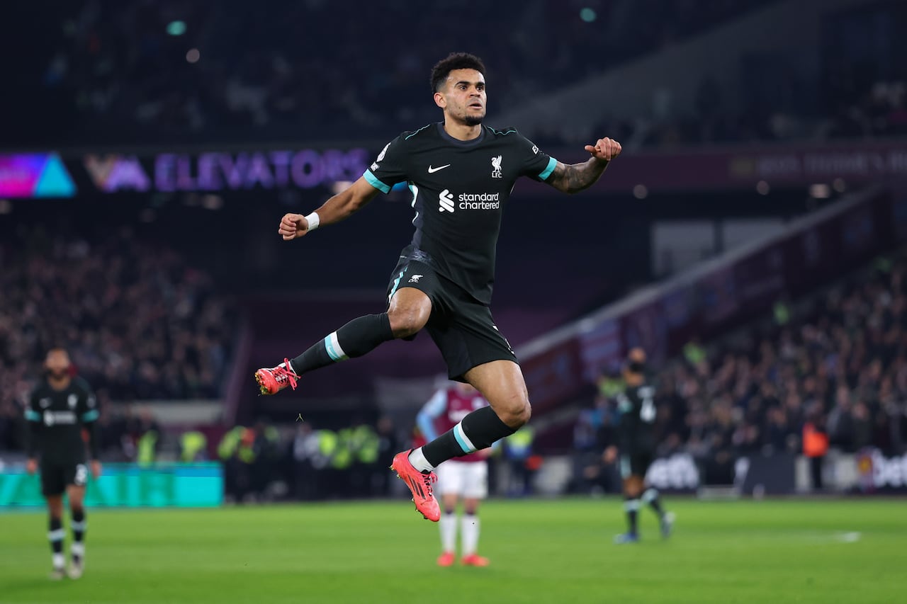 iLONDON, ENGLAND - DECEMBER 29: Luis Diaz of Liverpool celebrates scoring the first goal during the Premier League match between West Ham United FC and Liverpool FC at London Stadium on December 29, 2024 in London, England. (Photo by Marc Atkins/Getty Images)