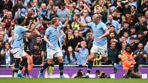Manchester City's Norwegian striker #09 Erling Haaland (C) celebrates after scoring his team first goal during the English Premier League football match between Manchester City and Brentford at the Etihad Stadium in Manchester, north west England, on September 14, 2024. (Photo by Oli SCARFF / AFP) / RESTRICTED TO EDITORIAL USE. No use with unauthorized audio, video, data, fixture lists, club/league logos or 'live' services. Online in-match use limited to 120 images. An additional 40 images may be used in extra time. No video emulation. Social media in-match use limited to 120 images. An additional 40 images may be used in extra time. No use in betting publications, games or single club/league/player publications. /