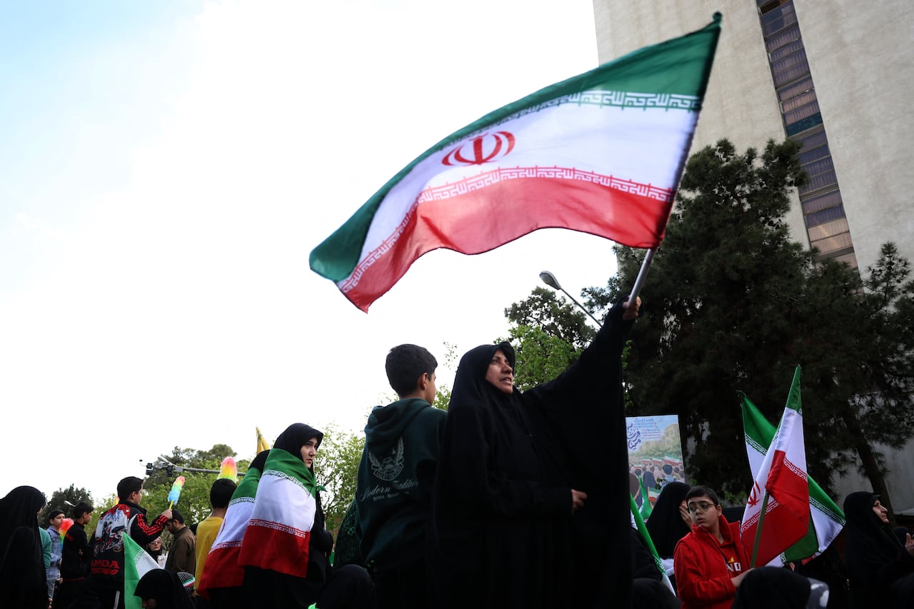 Iranians rally during a memorial, 40 days after a deadly strike on a children�s school in the southern city of Minab on the first day of the war that killed at least 165 people, most of them children, in Tehran on April 7, 2026. On February 28, Israel and the United States launched strikes on Iran, killing its supreme leader and triggering a war that spread across the Middle East. (Photo by AFP) /