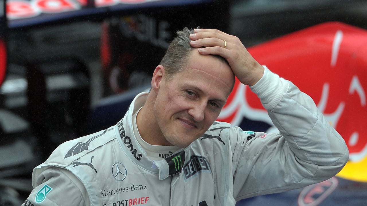 (FILES) In this file photo taken on November 25, 2012 then German Formula One driver Michael Schumacher gestures at the end of Brazil's F1 Grand Prix at the Interlagos racetrack in Sao Paulo, Brazil. German prosecutors said on September 25, 2024 they were bringing charges against three men arrested this year over a blackmail plot targeting the family of Formula One legend Michael Schumacher. They said the chief suspect, a 53-year-old man from the western German city of Wuppertal, had threatened to release private photos and videos and demanded 15 million euros (USD 16.7 million) from Schumacher's family. These allegedly included images of the seven-time Formula One champion before and after the 2013 skiing accident in the French Alps which left him with a serious brain injury. (Photo by Yasuyoshi CHIBA / AFP)