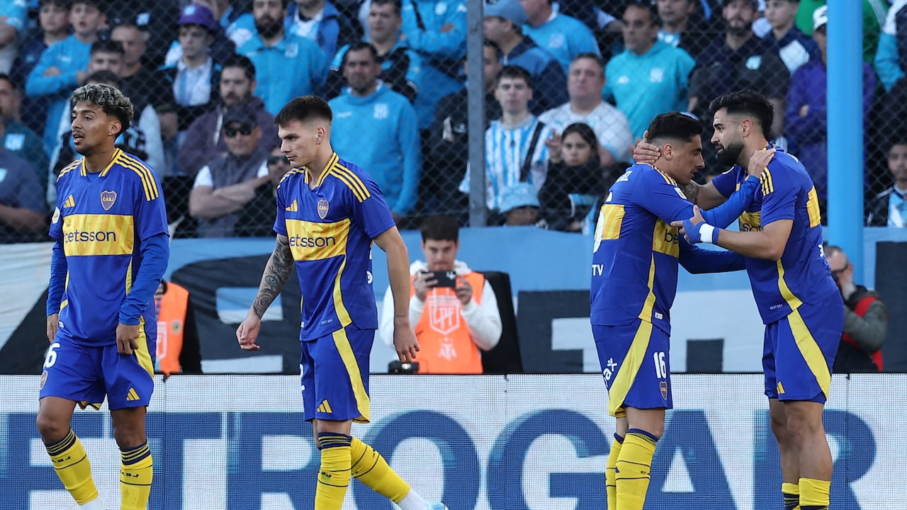 Boca Juniors' forward Milton Gimenez (R) celebrates with teammate Uruguayan forward Miguel Merentiel after scoring a goal during the Argentine Professional Football League Tournament 2024 'Cesar Luis Menotti' match between Racing Club and Boca Juniors at the Presidente Peron stadium in Avellaneda, Buenos Aires province, on September 14, 2024. (Photo by ALEJANDRO PAGNI / AFP)