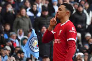 Liverpool's Trent Alexander-Arnold celebrates after scoring his side's opening goal during the English Premier League soccer match between Manchester City and Liverpool at Etihad stadium in Manchester, England, Saturday, Nov. 25, 2023. (AP Photo/Rui Vieira)