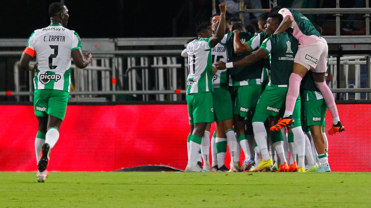 Players of Atletico Nacional celebrate after scoring during the Copa Libertadores round of 16 first leg football match between Colombia's Atletico Nacional and Argentina's Racing Club at the Atanasio Girardot stadium in Medellin, Colombia, on August 3, 2023. (Photo by Fredy BUILES / AFP)