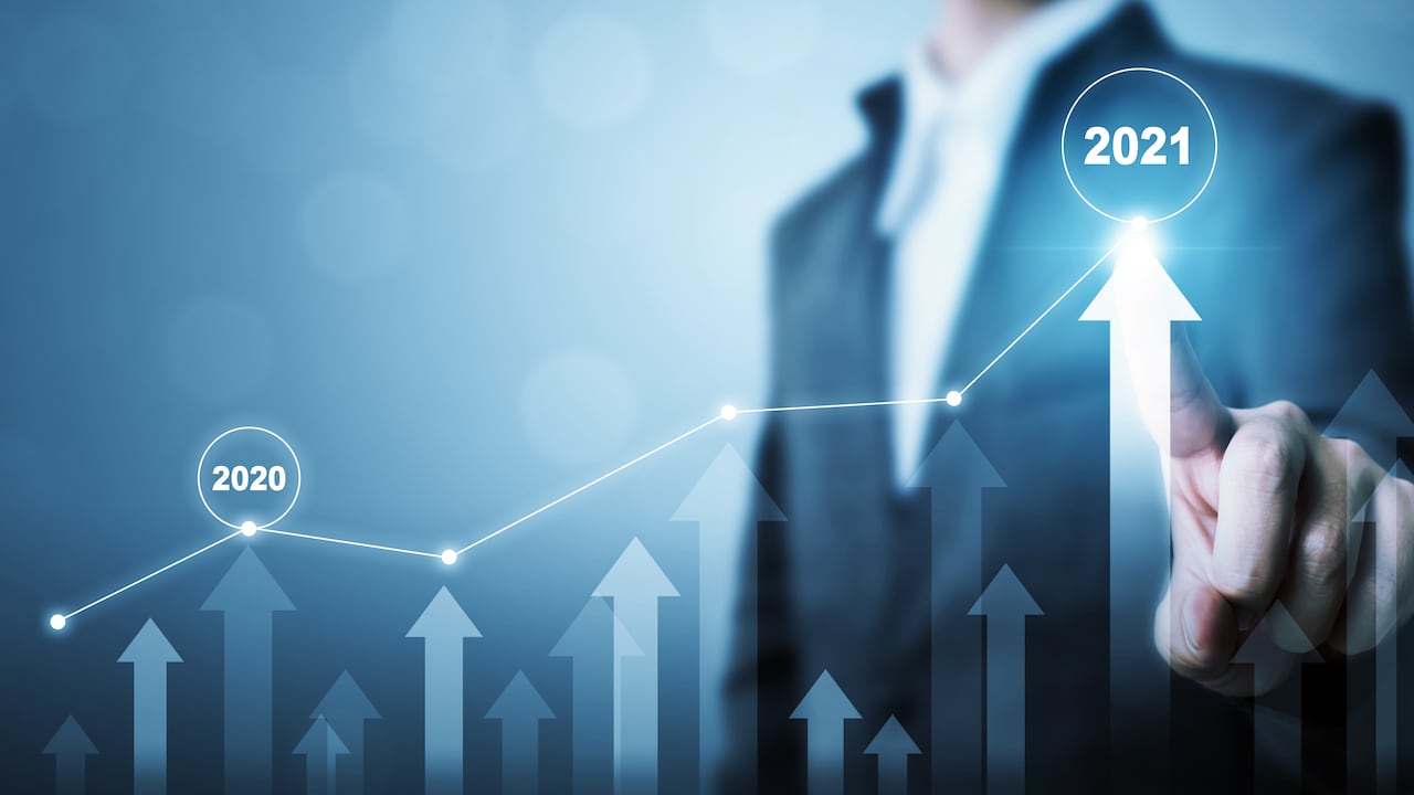 Businessman pointing arrow graph corporate future growth plan. Business development to success and growing growth year 2020 to 2021 concept