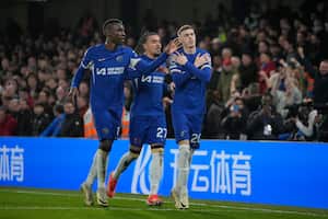 Chelsea's Cole Palmer, right, celebrates after scoring his side's second goal during the English Premier League soccer match between Chelsea and Manchester United at Stamford Bridge in London, Thursday, April 4, 2024. (AP Photo/Kin Cheung)