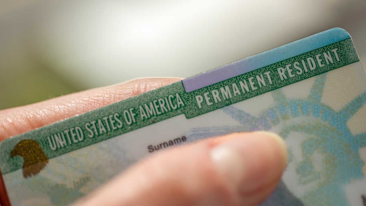 (Green) card of USA on blurred background.