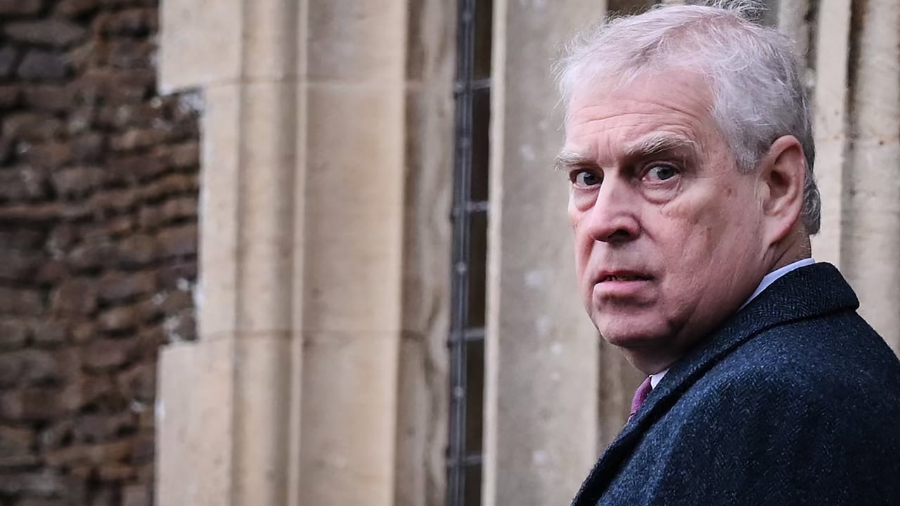(FILES) Britain's Prince Andrew, Duke of York reacts as he arrives for the Royal Family's traditional Christmas Day service at St Mary Magdalene Church in Sandringham, Norfolk, eastern England, on December 25, 2022. UK police said February 19, 2026, officers were searching two addresses, one in eastern England and one west of London, following the arrest of ex-Prince Andrew on suspicion of misconduct in a public office. New revelations last week appeared to show Andrew sent convicted sex offender Jeffrey Epstein potentially confidential documents during his time as a UK trade envoy. (Photo by Daniel LEAL / AFP)