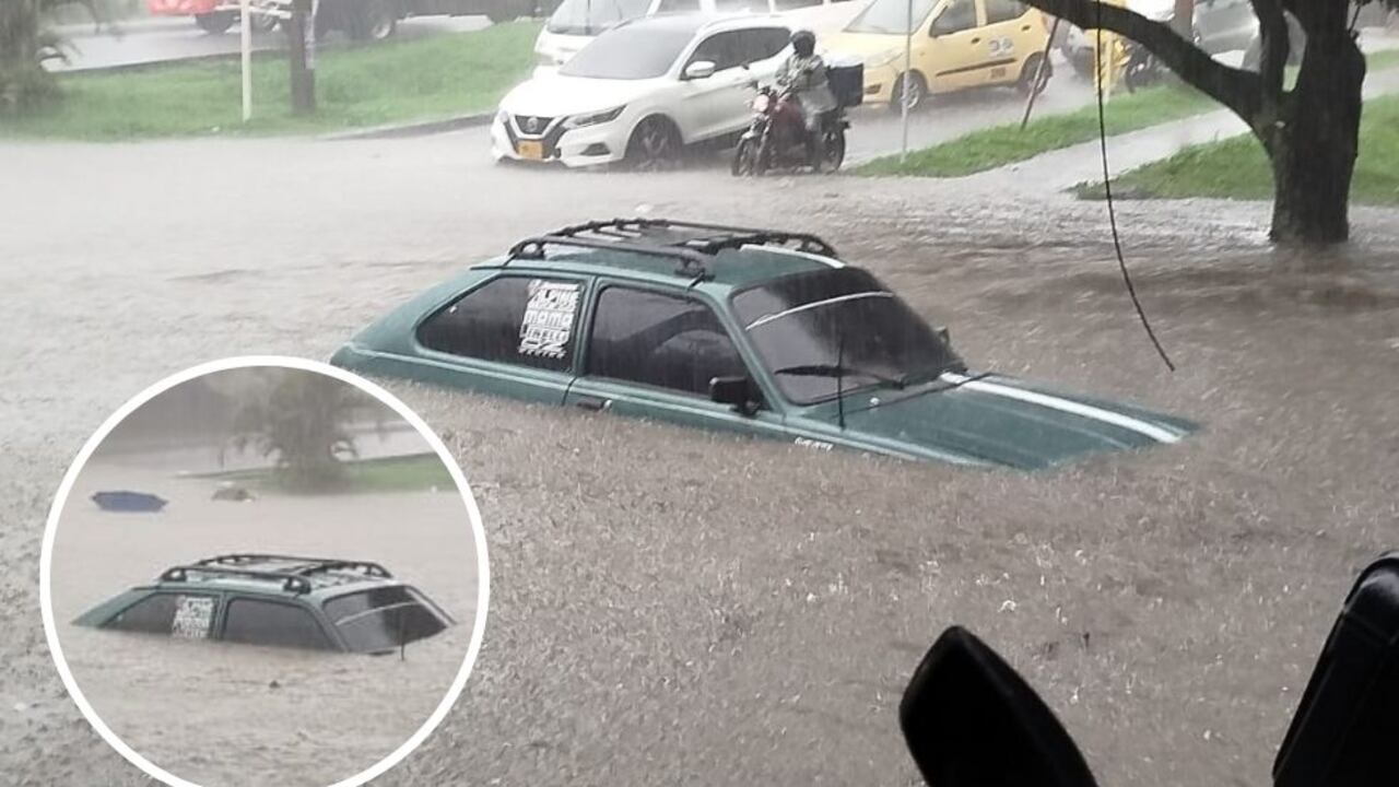 Carro atrapado en la Avenida 4 norte por las fuertes lluvias en Cali.