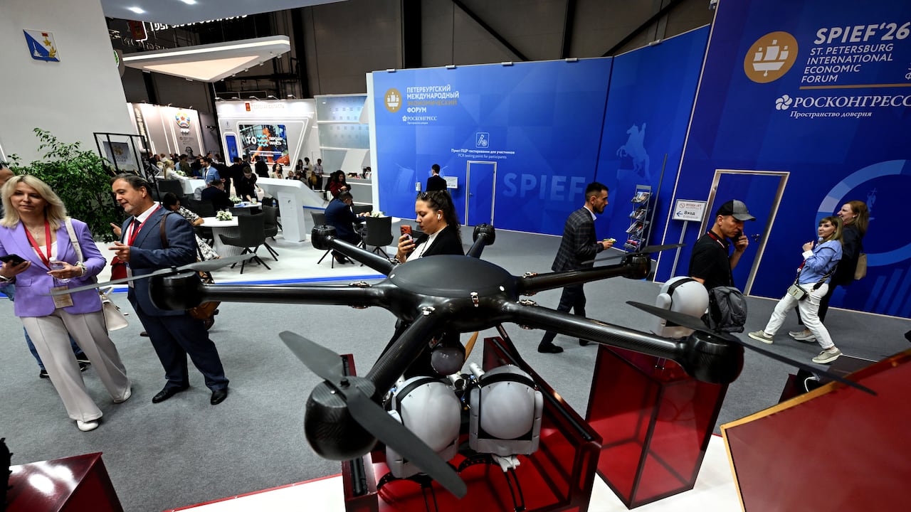 Participants tour an exhibition of the St. Petersburg International Economic Forum (SPIEF) in Saint Petersburg on June 3, 2026. (Photo by Olga MALTSEVA / AFP)