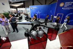 Participants tour an exhibition of the St. Petersburg International Economic Forum (SPIEF) in Saint Petersburg on June 3, 2026. (Photo by Olga MALTSEVA / AFP)
