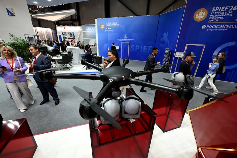 Participants tour an exhibition of the St. Petersburg International Economic Forum (SPIEF) in Saint Petersburg on June 3, 2026. (Photo by Olga MALTSEVA / AFP)