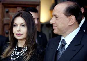 (FILES) FILES - Picture taken on shows June 4, 2004 shows Italian Prime Minister Silvio Berlusconi (R) and his wife Veronica Lario in Rome. Italian ex-prime minister Silvio Berlusconi died at age 86. (Photo by Vincenzo PINTO / AFP)