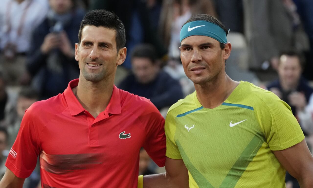 Serbia's Novak Djokovic, left, and Spain's Rafael Nadal pose ahead of their quarterfinal match at the French Open tennis tournament in Paris, France, Tuesday, May 31, 2022. The Australian Open tennis tournament begins Monday, Jan. 16, 2023. Nadal is the defending champion and who owns a men’s-record 22 majors. It is Djokovic, though, who will draw the most attention. (AP Photo/Christophe Ena