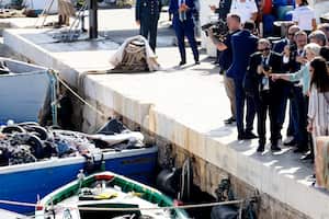 President of the European Commission, Ursula von der Leyen, right, points to migrants' belongings on a boat during her visit of the Sicilian island of Lampedusa, in Italy, Sunday, Sept. 17, 2023. EU Commission President Ursula von der Leyen and Italian Premier Giorgia Meloni on Sunday toured a migrant center on Italy’s southernmost island of Lampedusa that was overwhelmed with nearly 7,000 arrivals in a 24-hour period this week. (Cecilia Fabiano/LaPresse via AP)
