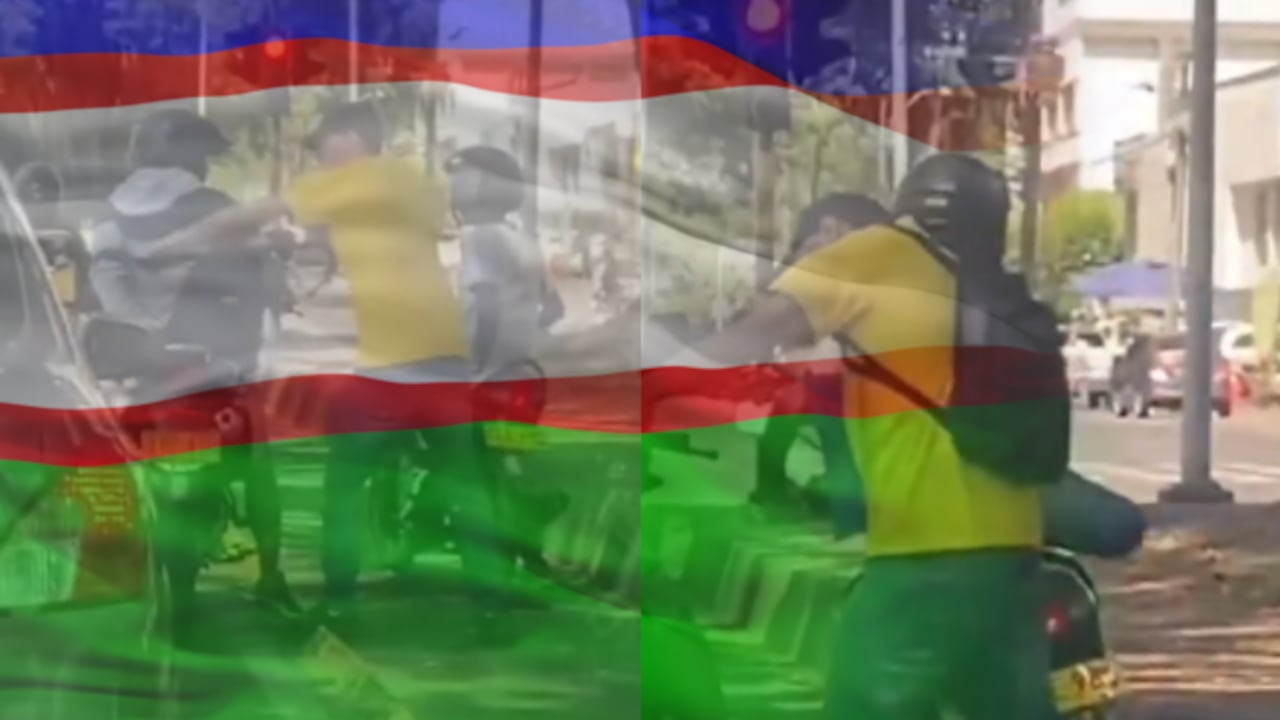 Un motociclista fue abordado por hombres armados en un semáforo de Cali, le robaron todo.