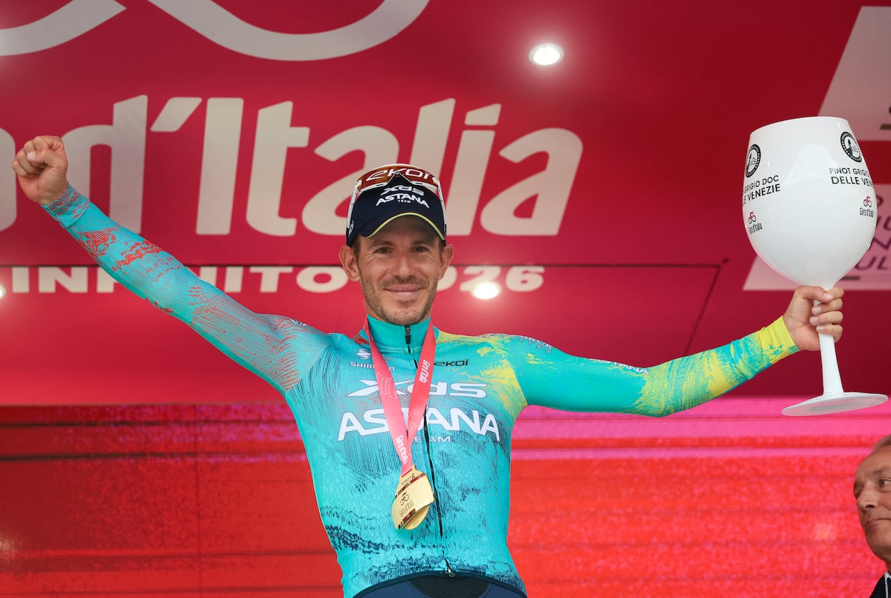 XDS Astana Team Italian rider Davide Ballerini celebrates on the podium after winning the 6th stage of the Giro d'Italia 2026 - Tour of Italy cycling race between Paestum and Naples, southern Italy on May 14, 2026. (Photo by Luca Bettini / AFP)