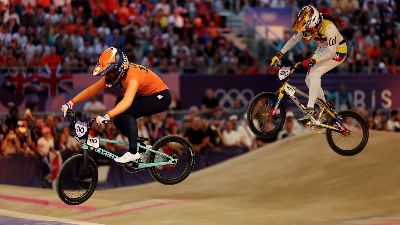 PARIS, FRANCE - AUGUST 02: Laura Smulders of Team Netherlands and Mariana Pajon Londono of Team Colombia compete during the Women's Semi-Finals Run 2, Heat 2 on day seven of the Olympic Games Paris 2024 at Saint-Quentin-en-Yvelines BMX Stadium on August 02, 2024 in Paris, France. (Photo by Tim de Waele/Getty Images)