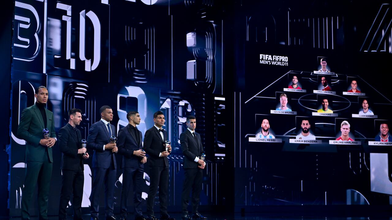 PARIS, FRANCE - FEBRUARY 27: Players included in the FIFA FIFPRO Men's World 11 2022 squad, from left, Virgil van Dijk, Lionel Messi, Kylian Mbappe, Achraf Hakimi, Casemiro and Joao Cancelo with their trophies during The Best FIFA Football Awards 2022 at Salle Pleyel on February 27, 2023 in Paris, France. (Photo by Brendan Moran - FIFA/FIFA via Getty Images)
