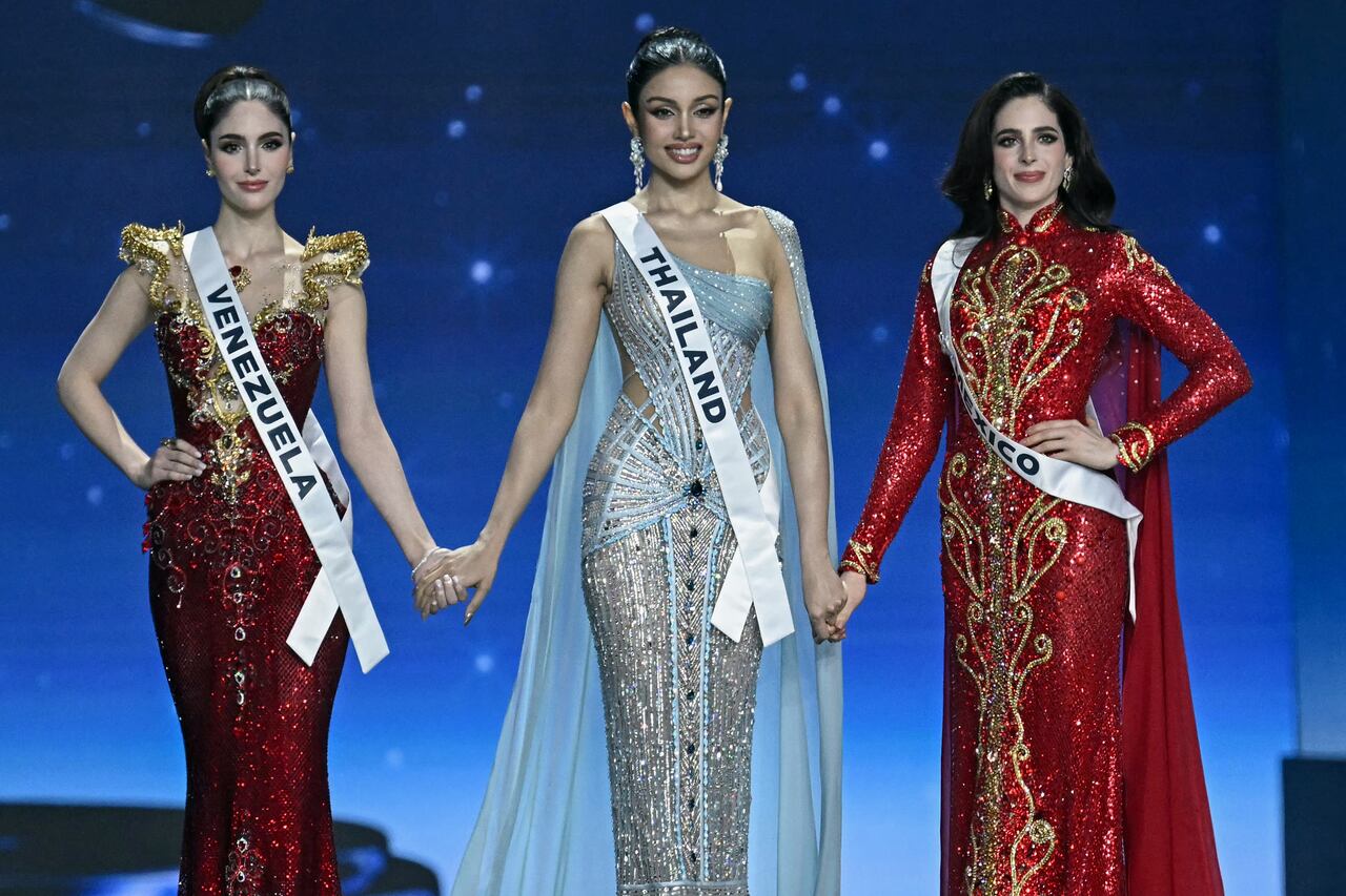 Miss Mexico Fatima Bosch (R), Miss Thailand Praveenar Singh (C) and Miss Venezuela Stephany Adriana Abasali Nasser (L) wait before the top two places are announced at the 2025 Miss Universe pageant in Nonthaburi, north of Bangkok, on November 21, 2025. (Photo by Lillian SUWANRUMPHA / AFP)