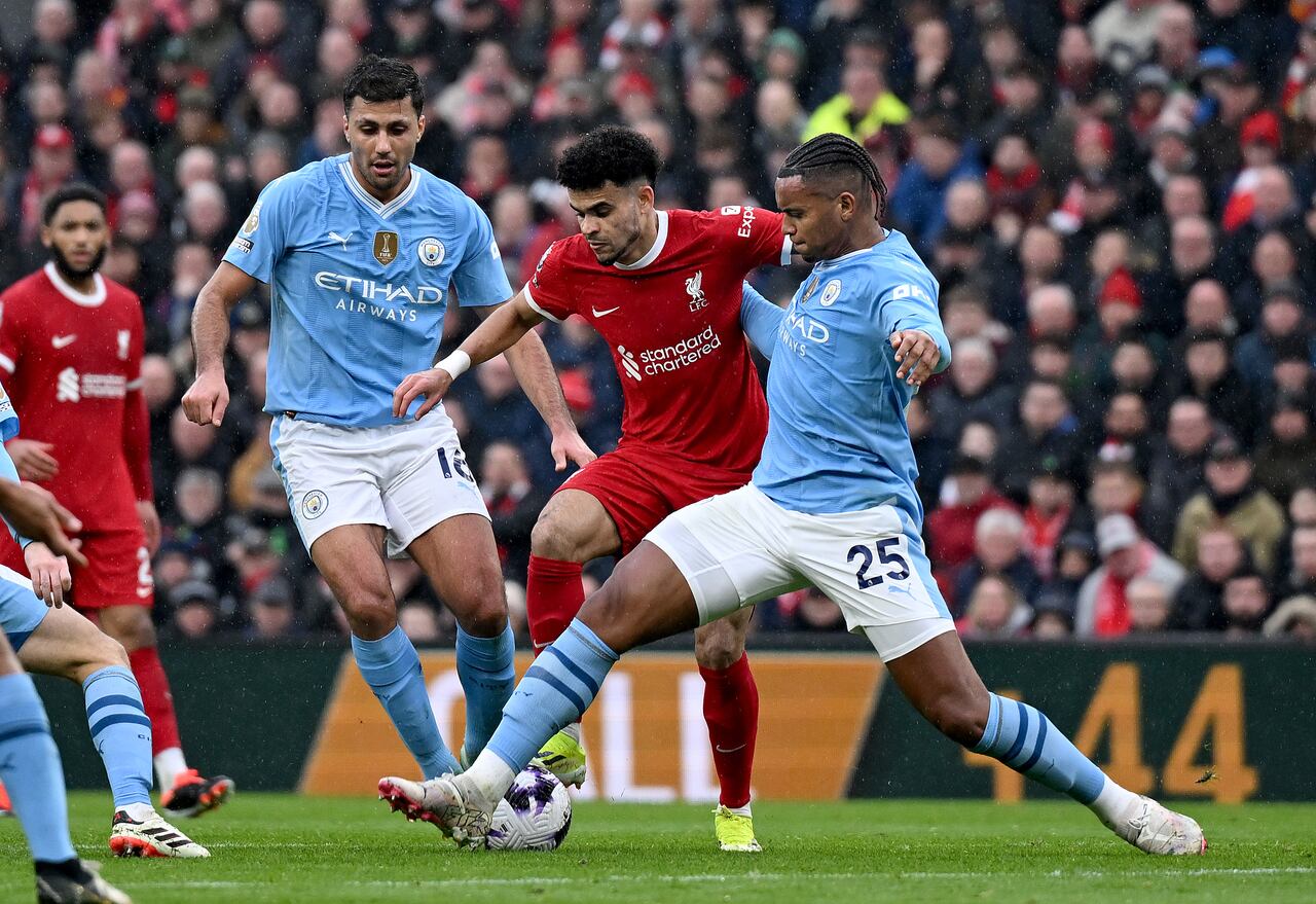 LIVERPOOL, ENGLAND - MARCH 10: (THE SUN OUT, THE SUN ON SUNDAY OUT) Luis Diaz of Liverpool and Manuel Akanji of Manchester City in action during the Premier League match between Liverpool FC and Manchester City at Anfield on March 10, 2024 in Liverpool, England. (Photo by Nick Taylor/Liverpool FC/Liverpool FC via Getty Images)