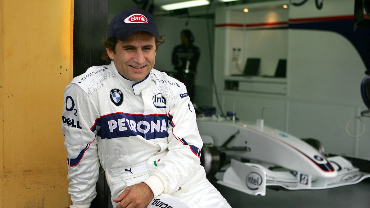 (FILES) Italian F1 driver Alex Zanardi who lost his both legs in an accident 15 September 2001 during a kart championships in Germany gestures after a BMW practice session at the racetrack Ricardo Tormo in Cheste near Valencia 25 November 2006. Alex Zanardi, the Italian racing car driver who became a Paralympic cycling champion after losing both legs in an accident, has died aged 59, his family announced on May 2, 2026. Zanardi, one of his country's most loved and respected sportsmen, who as credited with helping transformed the perception of disability in Italy, died on the evening of May 1. (Photo by Jose Jordan / AFP)