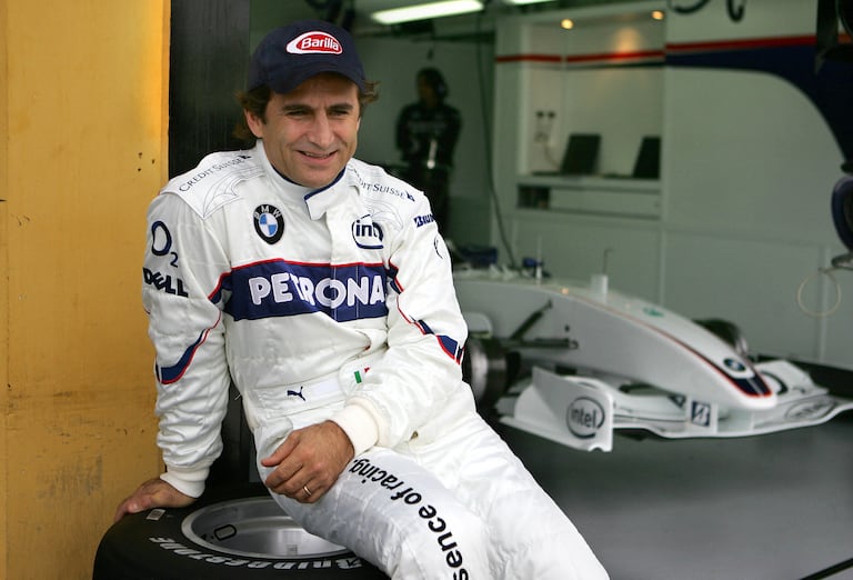 (FILES) Italian F1 driver Alex Zanardi who lost his both legs in an accident 15 September 2001 during a kart championships in Germany gestures after a BMW practice session at the racetrack Ricardo Tormo in Cheste near Valencia 25 November 2006. Alex Zanardi, the Italian racing car driver who became a Paralympic cycling champion after losing both legs in an accident, has died aged 59, his family announced on May 2, 2026. Zanardi, one of his country's most loved and respected sportsmen, who as credited with helping transformed the perception of disability in Italy, died on the evening of May 1. (Photo by Jose Jordan / AFP)