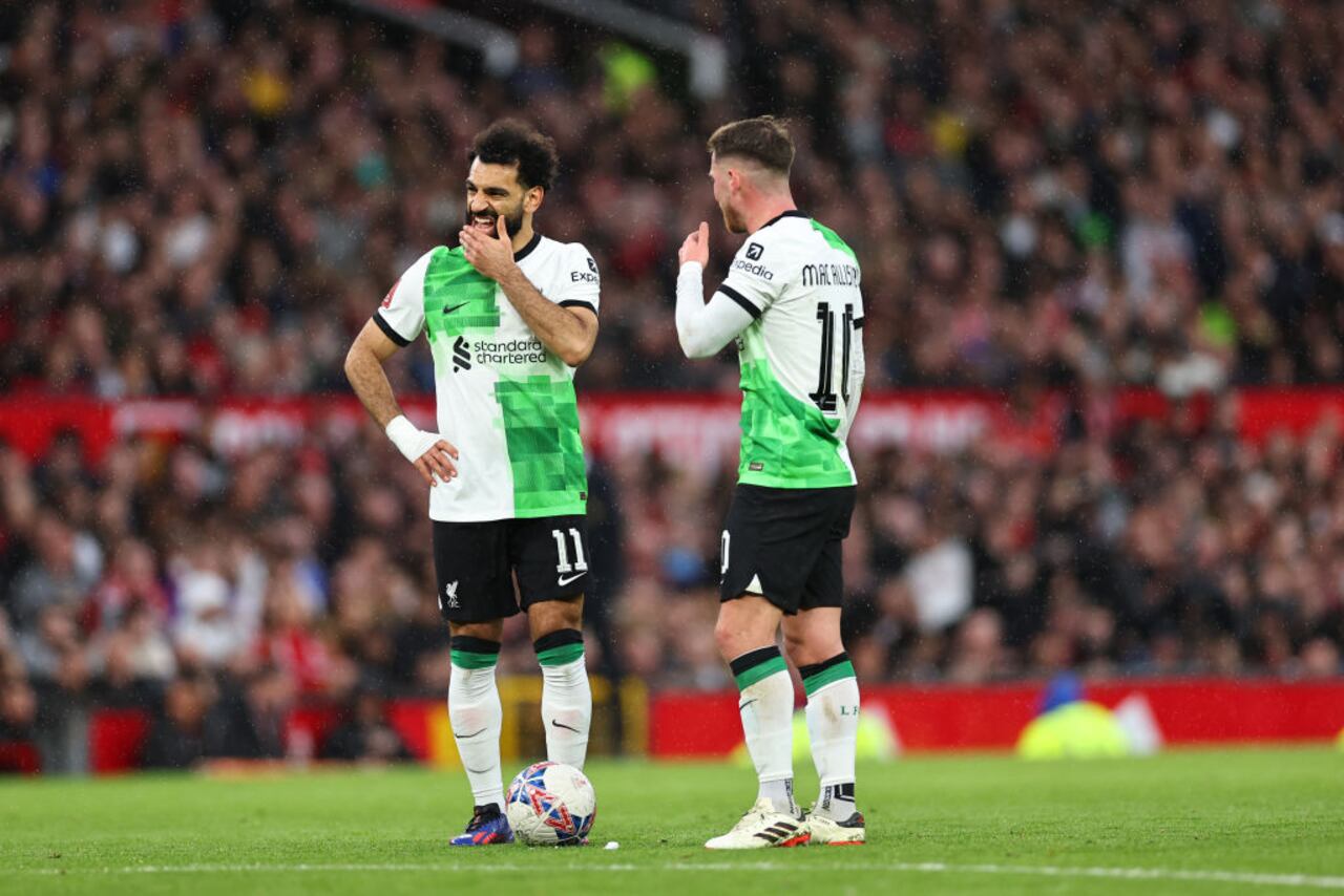 MANCHESTER, ENGLAND - MARCH 17: Mohamed Salah Alexis Mac Allister of Liverpool during the Emirates FA Cup Quarter Final match between Manchester United and Liverpool at Old Trafford on March 17, 2024 in Manchester, England. (Photo by Robbie Jay Barratt - AMA/Getty Images)