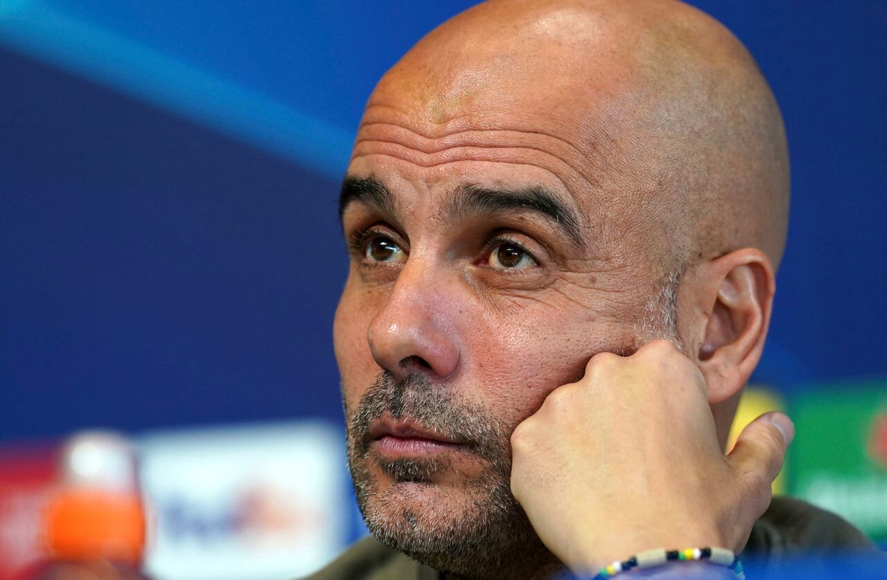 Manchester City manager Pep Guardiola meets the media during a press conference ahead of Wednesday's Champions League, semifinal, return-leg soccer match against Real Madrid, at City Football Academy, Manchester, England, Tuesday May 16, 2023. (Martin Rickett/PA via AP)
