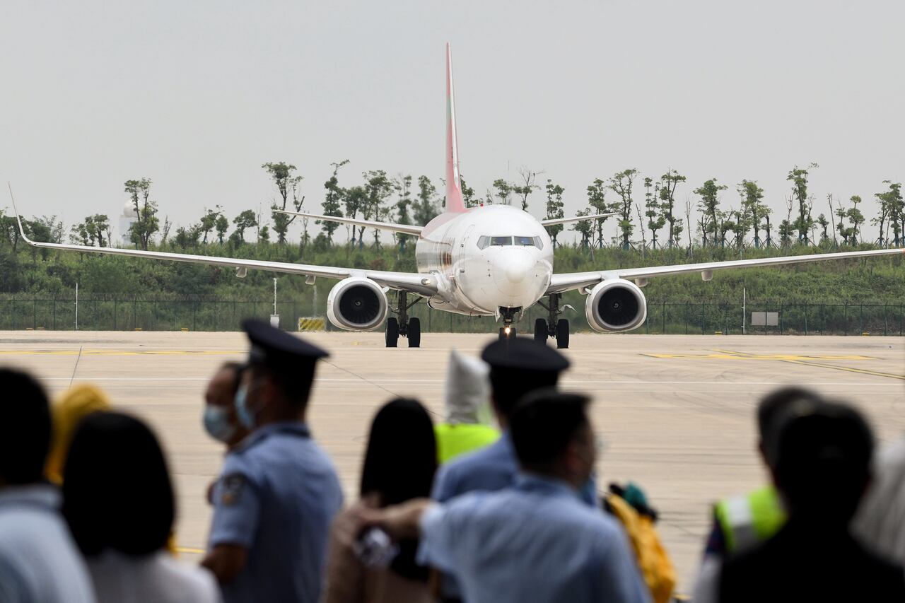 In this photo taken on September 16, 2020, a Boeing 737-800 operated by South Korean carrier T'way taxis after landing at Wuhan's Tianhe International Airport in China's central Hubei province. - China's Wuhan, ground zero for the coronavirus outbreak which has since swept the globe, has reopened its airport for international passenger flights, ending an eight-month moratorium since the deadly pathogen first emerged. (Photo by STR / AFP) / China OUT