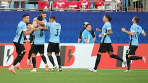 CHARLOTTE, NORTH CAROLINA - JULY 13: Rodrigo Bentancur of Uruguay celebrates with teammates after scoring the team's first goal during the CONMEBOL Copa America 2024 third place match between Uruguay and Canada at Bank of America Stadium on July 13, 2024 in Charlotte, North Carolina. Grant Halverson/Getty Images/AFP (Photo by GRANT HALVERSON / GETTY IMAGES NORTH AMERICA / Getty Images via AFP)