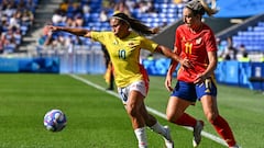Colombia's midfielder #10 Leicy Santos and Spain's midfielder #11 Alexia Putellas compete for the ball during the women's quarter-final football match between Spain and Colombia during the Paris 2024 Olympic Games at the Lyon Stadium in Lyon on August 3, 2024. (Photo by Arnaud FINISTRE / AFP)