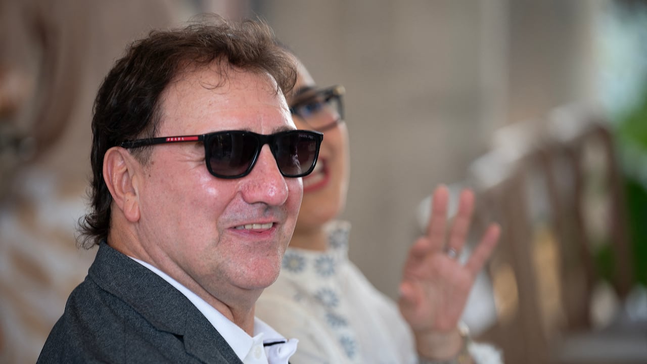 Colombia's national football team coach, Argentine Nestor Lorenzo, smiles during the visit of FIFA President Gianni Infantino to the new Concentration Hotel of the Colombian Football Federation in Barranquilla, Colombia, on February 24, 2026. FIFA boss Gianni Infantino told AFP on February 24, 2026, he was "very reassured" about Mexico's hosting of games in the World Cup, in his first comments on the violence triggered by the killing of a drug cartel leader. (Photo by David SALAZAR / AFP)