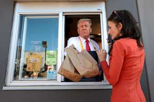 FEASTERVILLE-TREVOSE, PENNSYLVANIA - OCTOBER 20: Republican presidential nominee, former U.S. President Donald Trump works the drive-through line as he visits a McDonald's restaurant on October 20, 2024 in Feasterville-Trevose, Pennsylvania. Trump is campaigning the entire day in the state of Pennsylvania. Trump and Democratic presidential nominee Vice President Kamala Harris continue to campaign in battleground swing states ahead of the November 5 election. Win McNamee/Getty Images/AFP (Photo by WIN MCNAMEE / GETTY IMAGES NORTH AMERICA / Getty Images via AFP)