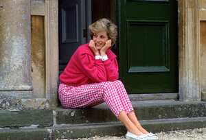 HIGHGROVE, UNITED KINGDOM - JULY 18: Diana, Princess Of Wales, Sitting On The Steps Outside Her Country Home, Highgrove. The Princess Is Casually Dressed In Pink Gingham Trousers With A Matching Pink Jumper. (Photo by Tim Graham Photo Library via Getty Images)
