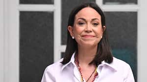 Venezuelan opposition leader Maria Corina Machado shows her ballot as she votes during the presidential election, in Caracas on July 28, 2024. Venezuelans vote Sunday between continuity in President Nicolas Maduro or change in rival Edmundo Gonzalez Urrutia amid high tension following the incumbent's threat of a "bloodbath" if he loses. (Photo by Federico PARRA / AFP)