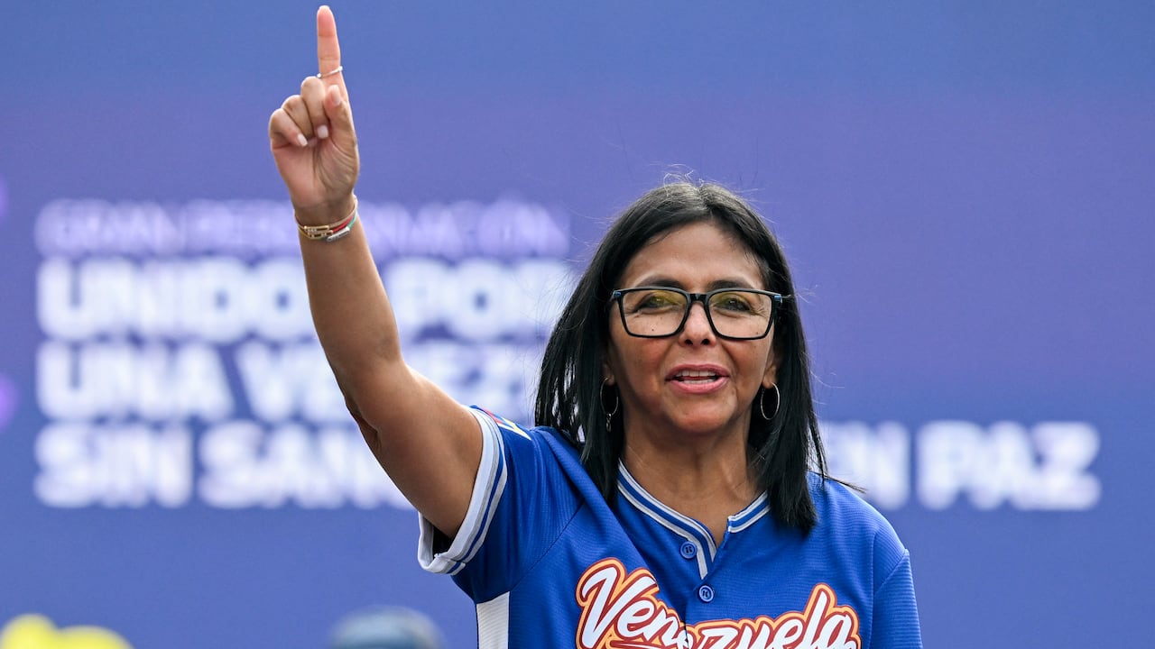 Venezuela's acting president Delcy Rodriguez gestures during a march calling for the lifting of all US sanctions in Caracas on April 30, 2026. Delcy Rodriguez announced on April 30 a 26% wage increase to the so-called "integral minimum income," raising it from 190 dollars to 240 dollars per month, the first adjustment since Nicolas Maduro's fall. (Photo by Juan BARRETO / AFP)
