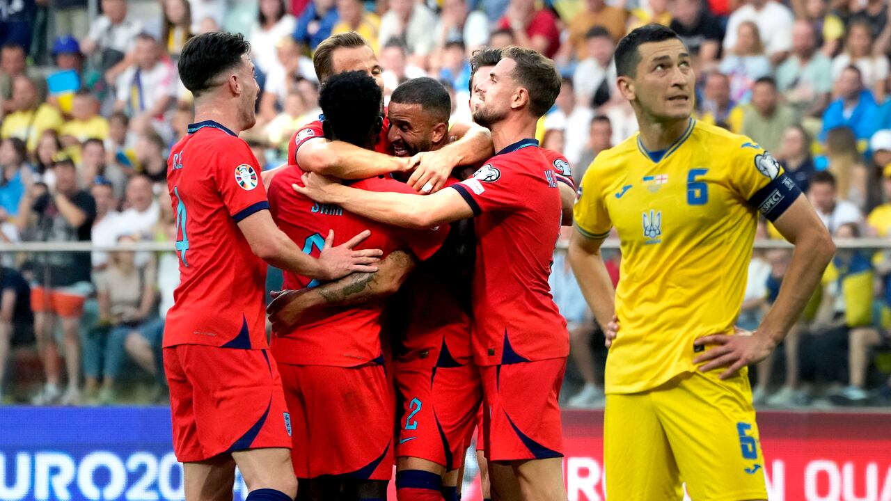 England's Kyle Walker, center, celebrates after scoring his side's first goal during the Euro 2024 group C qualifying soccer match between Ukraine and England in Wroclaw, Poland, Saturday, Sept. 9, 2023. (AP Photo/Czarek Sokolowski)