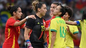 Brazil's forward #18 Gabi Portilho clashes with Spain's goalkeeper #13 Cata Coll in the women's semi-final football match between Brazil and Spain during the Paris 2024 Olympic Games at the Marseille Stadium in Marseille on August 6, 2024. (Photo by Sylvain THOMAS / AFP)
