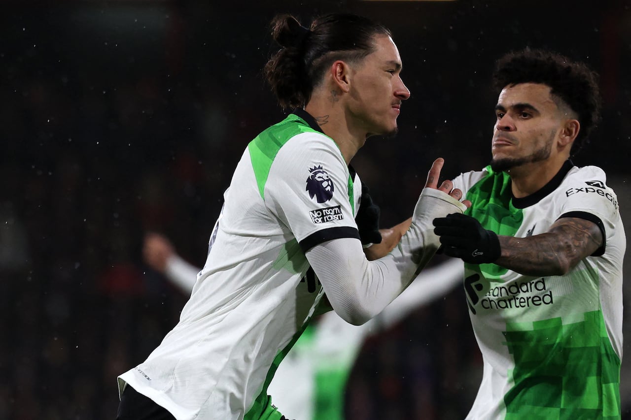 Liverpool's Uruguayan striker #09 Darwin Nunez (L) vies with Liverpool's Colombian midfielder #07 Luis Diaz (R) after scoring the opening goal of the English Premier League football match between Bournemouth and Liverpool at the Vitality Stadium in Bournemouth, southern England on January 21, 2024. (Photo by Adrian DENNIS / AFP) / RESTRICTED TO EDITORIAL USE. No use with unauthorized audio, video, data, fixture lists, club/league logos or 'live' services. Online in-match use limited to 120 images. An additional 40 images may be used in extra time. No video emulation. Social media in-match use limited to 120 images. An additional 40 images may be used in extra time. No use in betting publications, games or single club/league/player publications. /