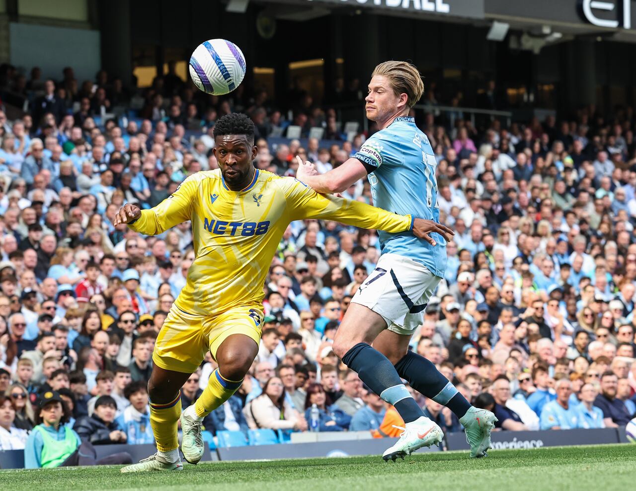 MANCHESTER, ENGLAND - APRIL 12: Crystal Palace's Jefferson Lerma turns with the ball under pressure from Manchester City's Kevin De Bruyne during the Premier League match between Manchester City FC and Crystal Palace FC at Etihad Stadium on April 12, 2025 in Manchester, England. (Photo by Lee Parker - CameraSport via Getty Images)