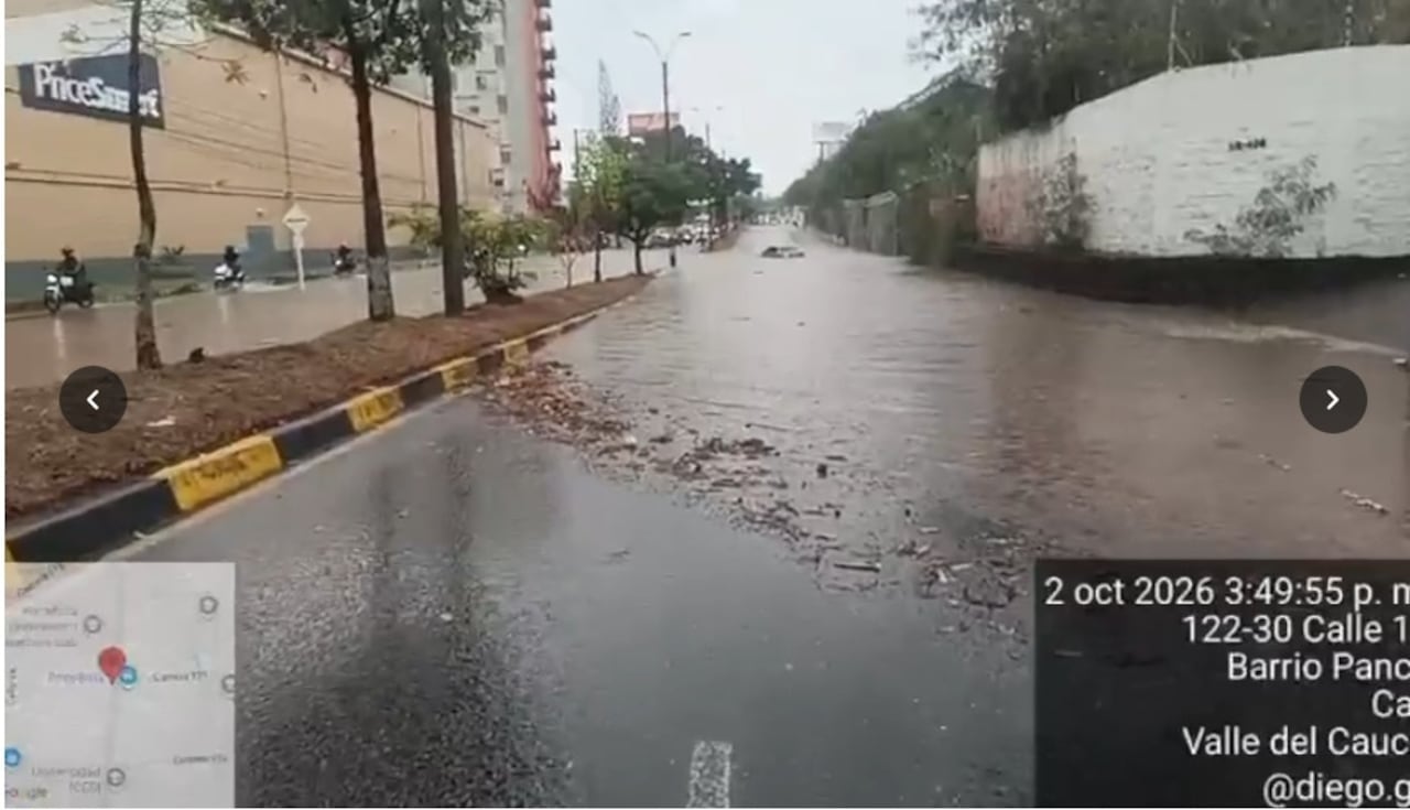 Calle 18 (frente a PriceSmart / Barrio Pance). Se registra inundación total sobre el corredor vial en ambos sentidos debido a las fuertes lluvias, con un vehículo atrapado en el sector.