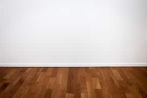 Empty white wall and wooden oak floor