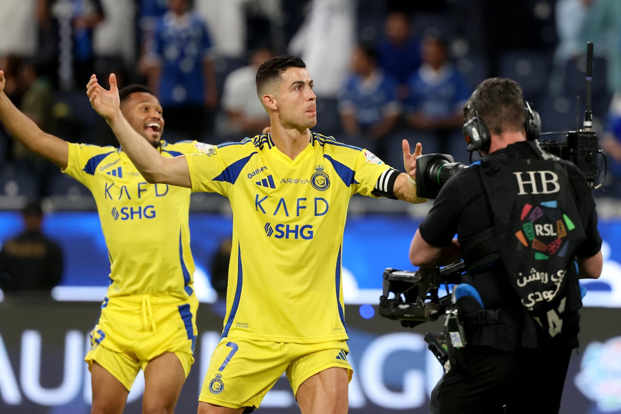 Nassr's Portuguese forward #7 Cristiano Ronaldo celebrates his team's win after the Saudi Pro League football match between Al-Hilal and Al-Nassr at the Kingdom Arena stadium in Riyadh on April 4, 2025. (Photo by Fayez NURELDINE / AFP)