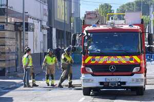 Firefighters work in front of a nightclub one day after a fire that at least killed thirteen people at a nightclub in Murcia, on October 2, 2023. At least 13 people were killed in a fire in a Spanish nightclub on October 1 in the morning, authorities said, with fears the toll could still rise as rescue workers sift through the debris. The fire appears to have broken out in a building housing the "Teatre" and "Fonda Milagros" clubs in the city of Murcia in southeastern Spain in the early morning hours. (Photo by JOSE JORDAN / AFP)